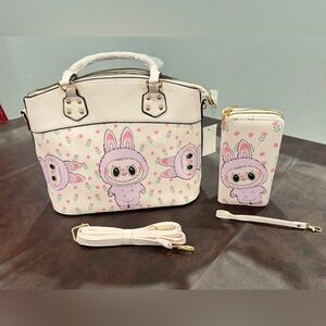 Pink The Monsters handbag with matching double sided double zipper wallet.